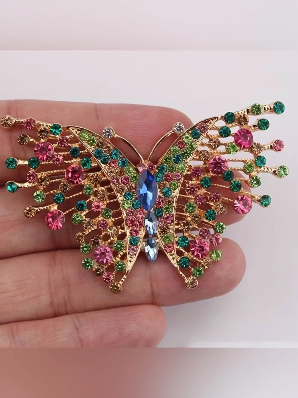 vintage gold-tone butterfly brooch adorned multicolored rhinestones & crystals